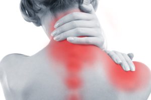Young woman with neck and shoulder pain close up